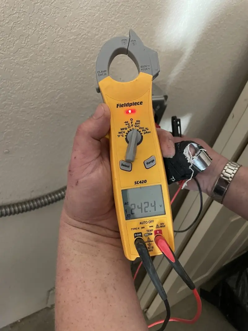 Voltage testing with clamp meter during Outlet Installation in Onondaga